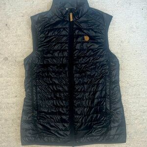 Black thin down filled womens vest.